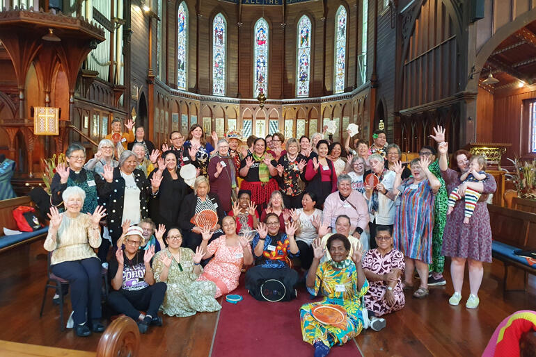 Women raise their hands to echo the 'Many Hands' theme of the AWSC 2023 Hui. Image: Ceridwyn Parr Women raise their hands to echo the 'Many Hands' theme of the AWSC 2023 Hui. Image: Ceridwyn Parr