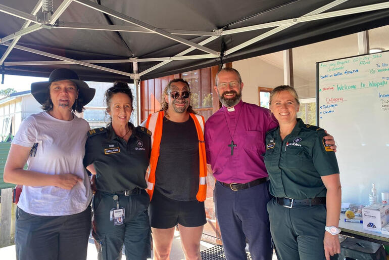 Bishop Andrew Hedge visits the evacuation centre team at Waipatu Marae. 