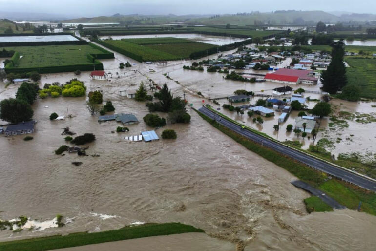Like many towns and rural villages across the North Island's East Coast, Omahu is swamped as its river burst its banks. Photo: Dawson Bliss