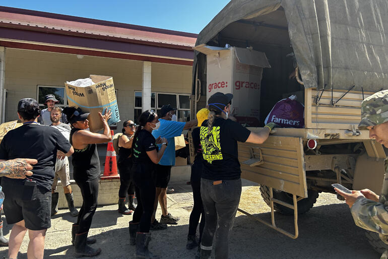 Volunteers at Omahu Marae unload emergency food items ready for distribution to flood-affected whānau.