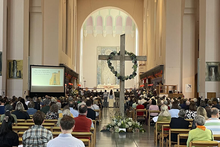 A floral cross sits empty to symbolise Christ's resurrection at Wellington Cathedral of St Paul on Easter Sunday.