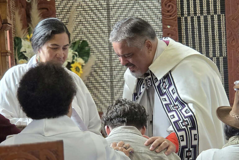 Archbishop Don Tamihere prays for a young person on Easter Sunday at St Mary's Tikitiki where 11 baptisms and 21 confirmations took place.