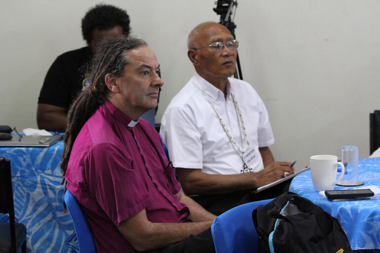 Archbishop Justin Duckworth and Archbishop Emeritus Winstin Halapua listen as CIVA resilience mapping trainers tell their story.