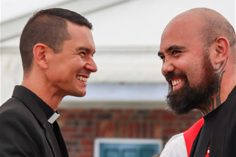 Chair of Te Kaunihera - St John's College Board, Ven Dr Lyndon Drake greets returning second year College student, Te Karere Scarborough. Chair of Te Kaunihera - St John's College Board, Ven Dr Lyndon Drake greets returning second year College student, Te Karere Scarborough.