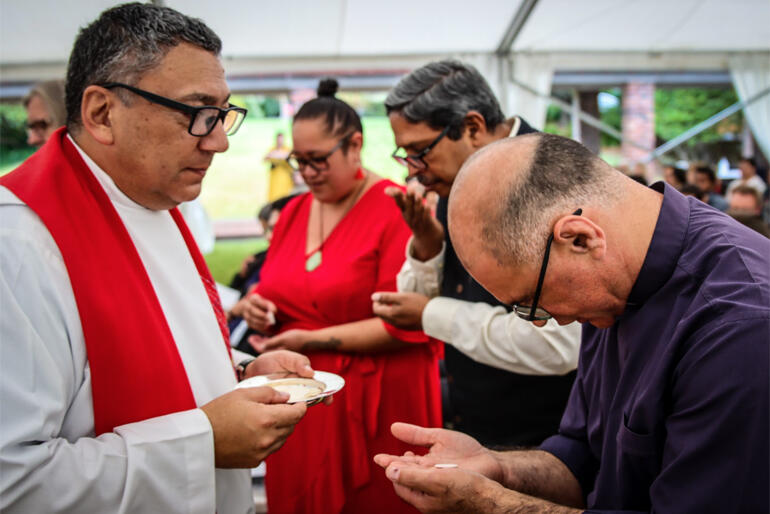 Principal Rev Katene Eruera serves communion to Tikanga Māori Acting Dean, Rev Dr Paul Reynolds at Tuesday's St John's College opening.