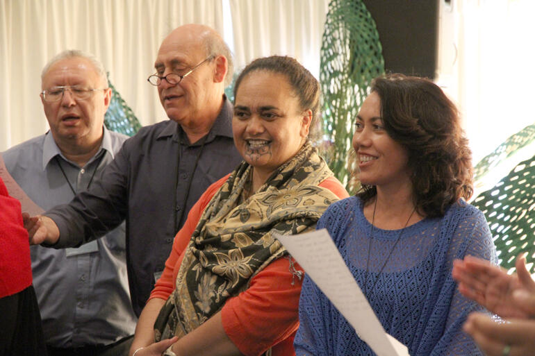 2014 Synod members sing to support the General Conference motion. (L-R): Rangi Nicholson, Ron McGough, Jacqui Chesley Ingle and Lynnore Pikaahu.