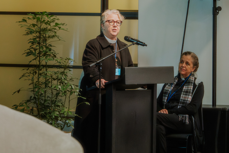 Rev Clare Barries calls for gender caucuses as Rev Dr Anne van Gend looks on. Rev Clare Barries calls for gender caucuses as Rev Dr Anne van Gend looks on.