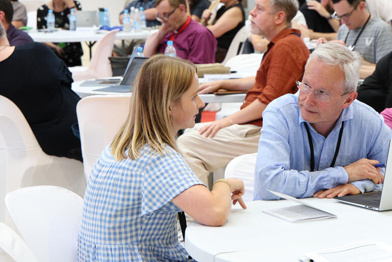 Lawyers Imogen Hensman and Anthony Hill confer on matters of process at the Diocese of Wellington table.