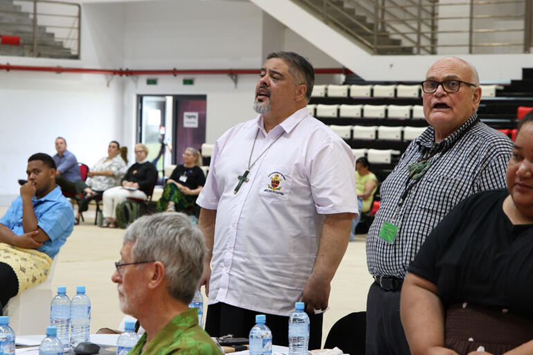 Archbishop Don Tamihere and Sir Herewini Parata stand to tautoko the speakers during the Equity Talanoa.