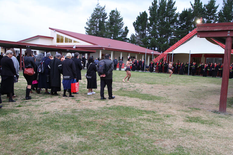 Te Hīnota Whānui walk onto the atea at Ōmahu. Te Hīnota Whānui walk onto the atea at Ōmahu.