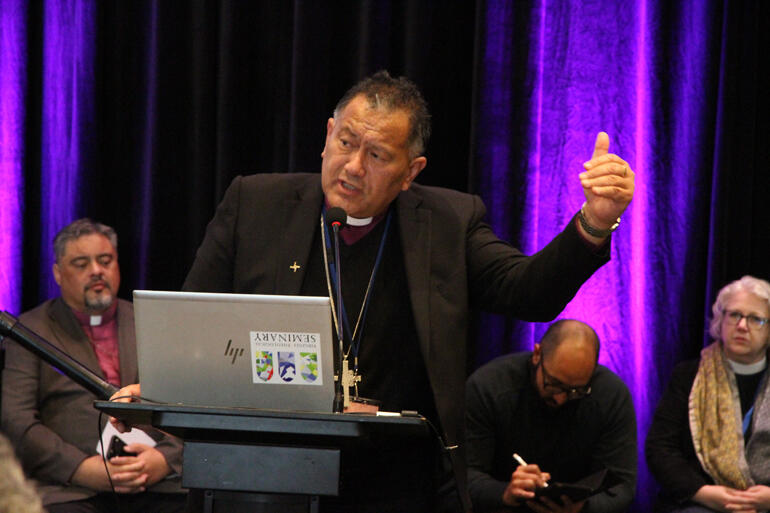 Bishop Te Kitohi Pikaahu addresses Synod to critique the impact of General Synod Standing Committee's decisions on mana and tapu. Bishop Te Kitohi Pikaahu addresses Synod to critique the impact of General Synod Standing Committee's decisions on mana and tapu.