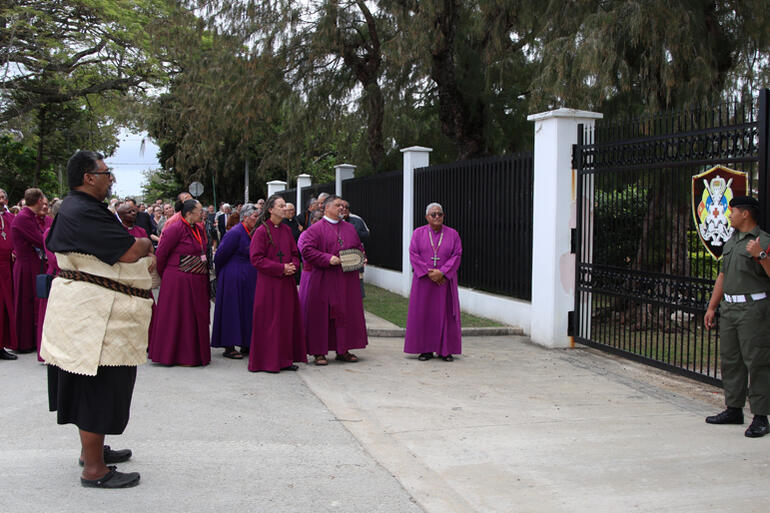 Fe'iloakitau Kaho Tevi brings the Synod to the Palace gates.