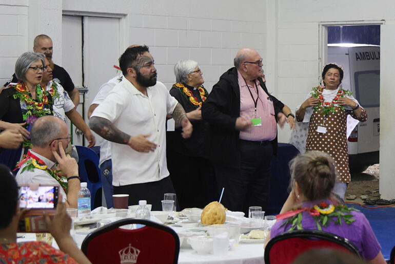 Sir Selwyn Parata leads a haka in appreciatrion for the cultural performances during the dinner hosted by St Andrew's High School.