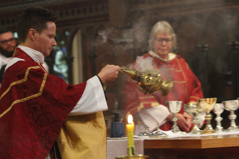 Vicar of St Michael and All Angels Fr Chris Orczy censes the gifts at the altar. Vicar of St Michael and All Angels Fr Chris Orczy censes the gifts at the altar.