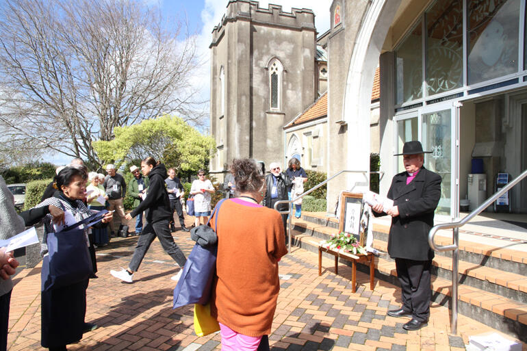 Archbishop David offers the first of his insights and instructions for pilgrims outside the Waikato Cathedral of St Peter's in Kirikiriroa (Hamilton).