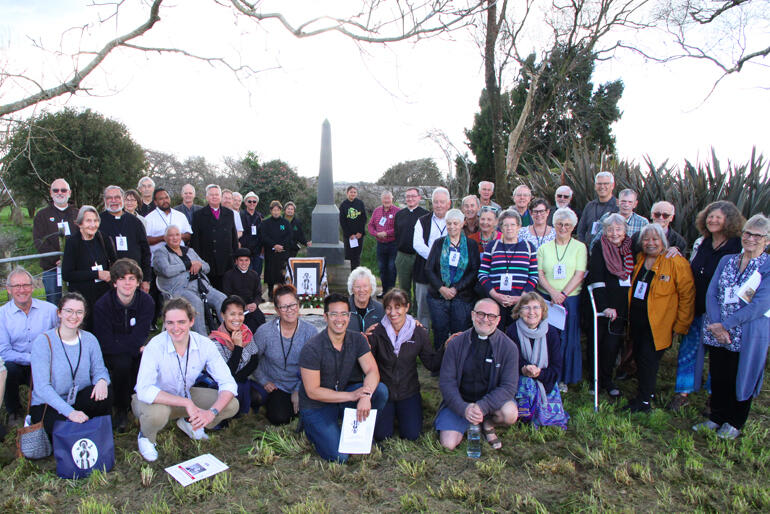 Members of the 2023 Anglo-Catholic Hui join with Ngāti Maniapoto at the foot of the memorial at the Battle of Oraakau during the 8 September hīkoi.