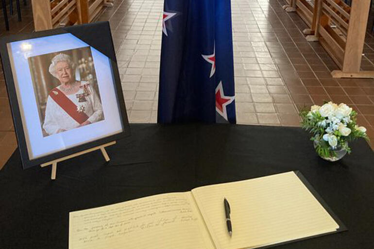A memorial table for Her Late Majesty Queen Elizabeth II greets mourners visiting the Wellington Cathedral of St Paul. A memorial table for Her Late Majesty Queen Elizabeth II greets mourners visiting the Wellington Cathedral of St Paul.