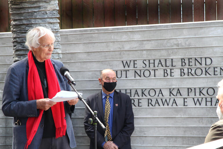 Archibald Baxter Memorial Trust Chair Prof Kevin Clements tells the story of the memorial to conscientious objectors as Edward Ellison looks on.