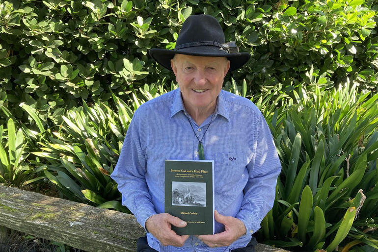 Education historian Michael Corboy with his history of early Pākehā - Māori missionary encounter, "Between God and a Hard Place." Education historian Michael Corboy with his history of early Pākehā - Māori missionary encounter, "Between God and a Hard Place."