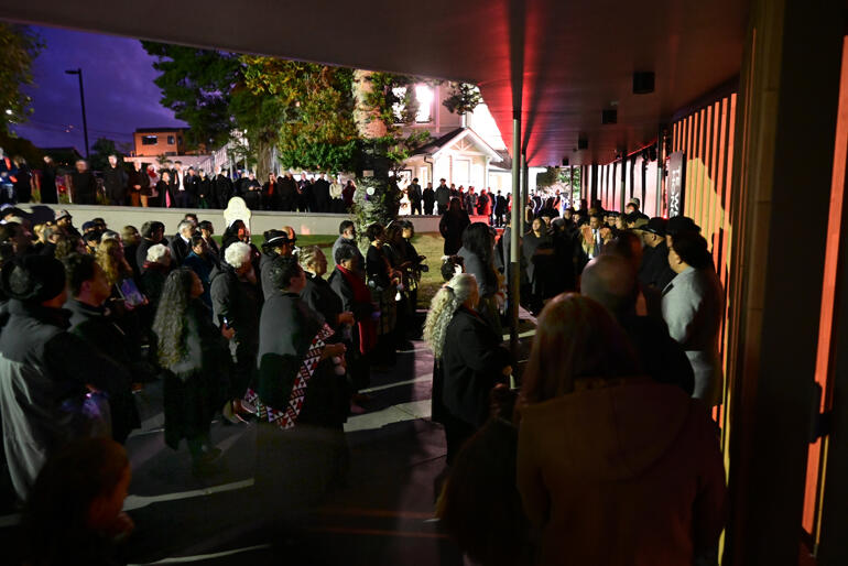The crowd gathers for karakia as Te Whare Hononga opens at dawn on 13 April 2023. The crowd gathers for karakia as Te Whare Hononga opens at dawn on 13 April 2023.