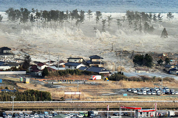 The tsunami hits Natori in Miyagi prefecture. Photo: Reuters