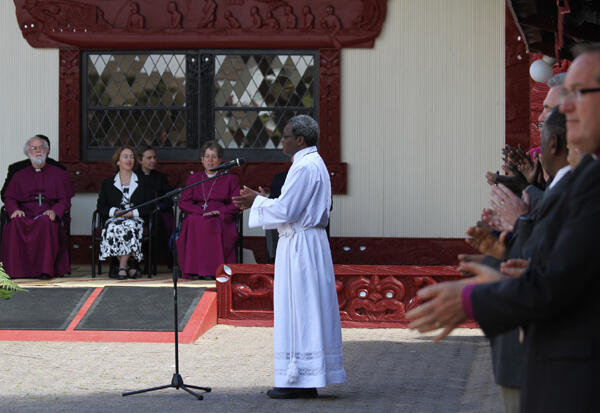 The ACC chair, Bishop James Tengatenga from Malawi, leads a waiata: "We are walking in the light of God."