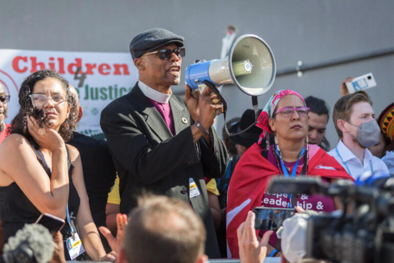 Anglican Communion Environmental Network Chair Archbishop Julio Murray speaks to the COP27 climate justice march. Photo: Green Anglicans Anglican Communion Environmental Network Chair Archbishop Julio Murray speaks to the COP27 climate justice march. Photo: Green Anglicans