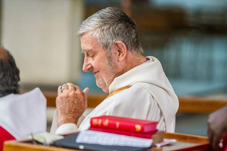 Bishop John Osmers prays during a service at the Anglican Consultative Council meeting in Lusaka, Zambia 2016.