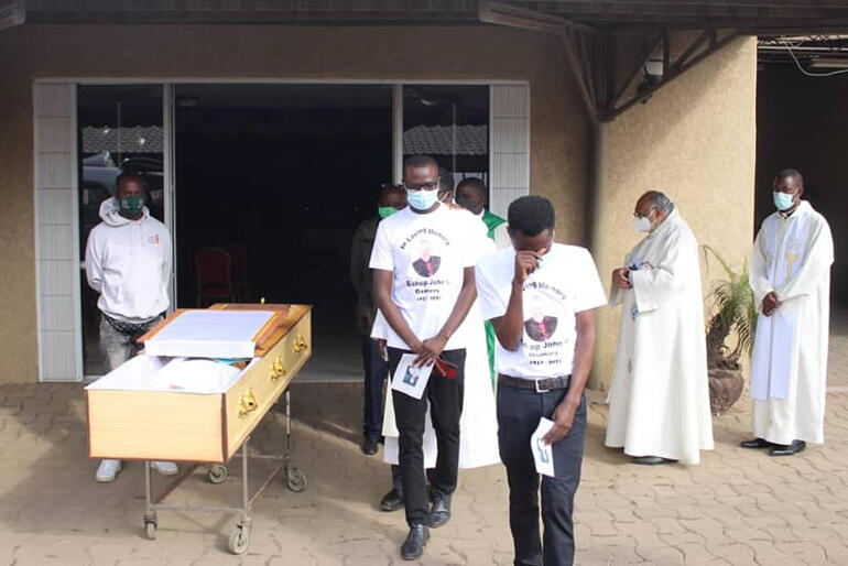 Refugee students and clergy mourn Bishop John Osmers at his funeral held under strict Covid limitations in Lusaka Cathedral this June.