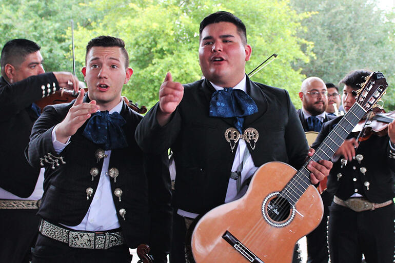 Members of Mariachi Los Trovadores of Austin, Texas, serenade the crowd. Members of Mariachi Los Trovadores of Austin, Texas, serenade the crowd.