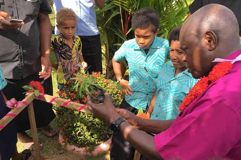 Archbishop John Sentamu plants a 'yasi' at St Christopher's Home, grounding his words on sustainability and care of creation.