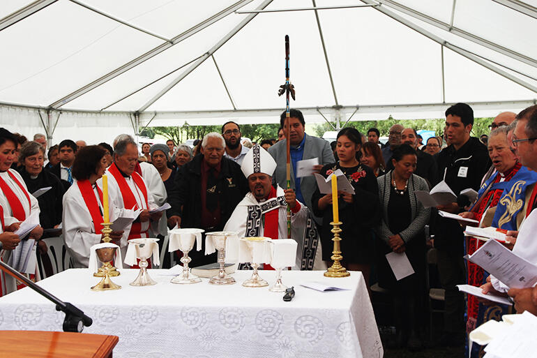 Bishop Don installed - with his daughter Danielle, wife Kisa and nephew Toka on his left. Bishop Don installed - with his daughter Danielle, wife Kisa and nephew Toka on his left.