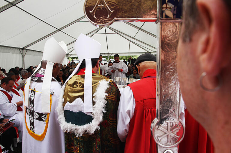 Bishop-elect Don makes his commitments - with the Primatial Cross in the foreground. Bishop-elect Don makes his commitments - with the Primatial Cross in the foreground.