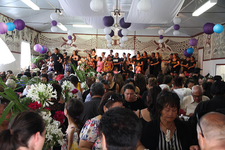 Back in Te Ao Marama: the hakari after the burial begins at Kauaetangohia.