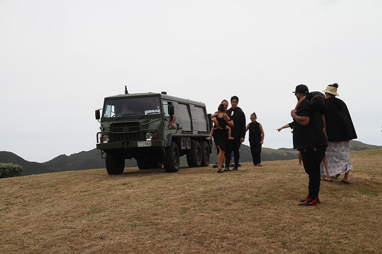 The Pinzgauer bearing Archbishop Brown leaves the Whangaparaoua church.