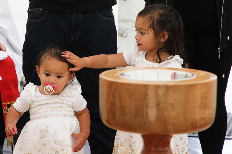 Here's irrefutable proof that there is a second baptism. The newly baptised Sophia Palaamo lays hands on Ariana Tanner.