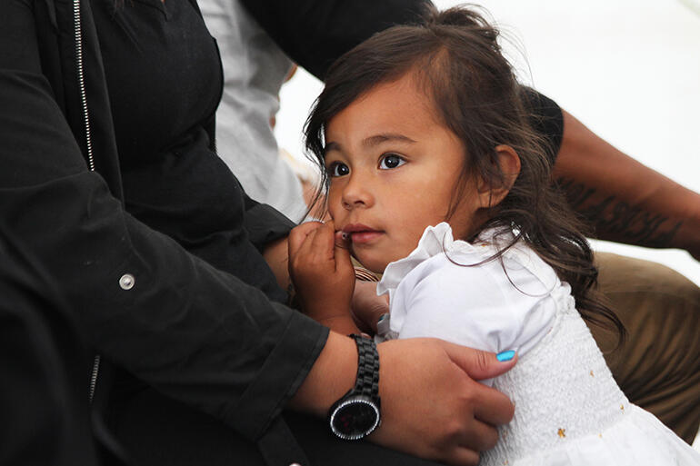 Sophia Palaamo waits for the baptisms to begin.