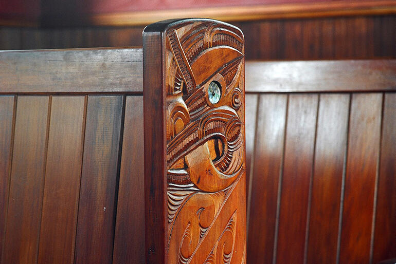 Detail of the end of a pew. Detail of the end of a pew.
