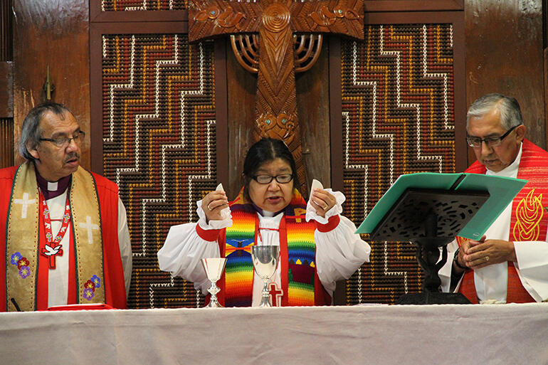 "We were baptised into one Body..." Bishop Lydia Mamakwa of Canada celebrates, flanked by Bishop Adam Halkett, and the Rev Sidney Black. "We were baptised into one Body..." Bishop Lydia Mamakwa of Canada celebrates, flanked by Bishop Adam Halkett, and the Rev Sidney Black.