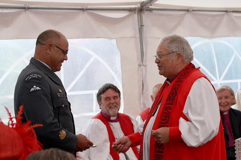 Bishop Rihari surprises Warrant Officer Peter Smith of the RNZAF. Bishop Rihari surprises Warrant Officer Peter Smith of the RNZAF.