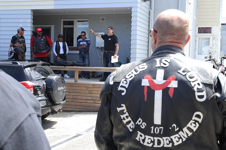 Dave Picot, the Road Captain, gives his briefing from the vicarage porch.