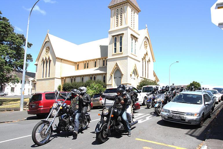 The Redeemed Motorcycle Ministry rumbles away from The Church of the Holy Sepulchre.