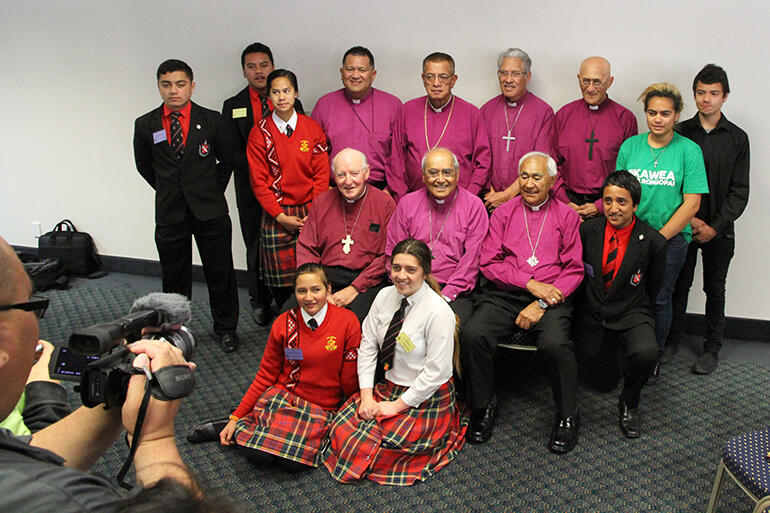 After the Sunday morning service, the bishops pose with some young friends from Te Aute and Hukarere.