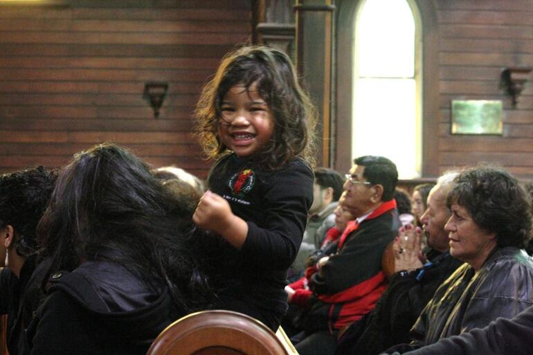 Kiyanah Paenga arranges her own entertainment during presentations in the church. Kiyanah Paenga arranges her own entertainment during presentations in the church.