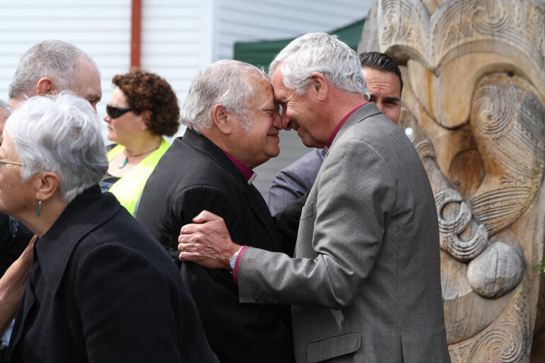 Bishop Richard greets Bishop-elect Richard in the powhiri.