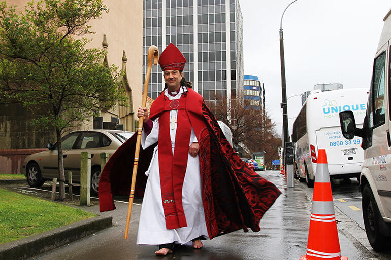 File shot: The cathedral is on Bishop Justin Duckworth's right - and the stricken office block is immediately behind him. File shot: The cathedral is on Bishop Justin Duckworth's right - and the stricken office block is immediately behind him.