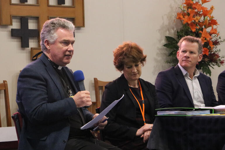 Dean Lawrence Kimberley talks to synod flanked by Suzanne Price and Richard Seville from CPT. Dean Lawrence Kimberley talks to synod flanked by Suzanne Price and Richard Seville from CPT.