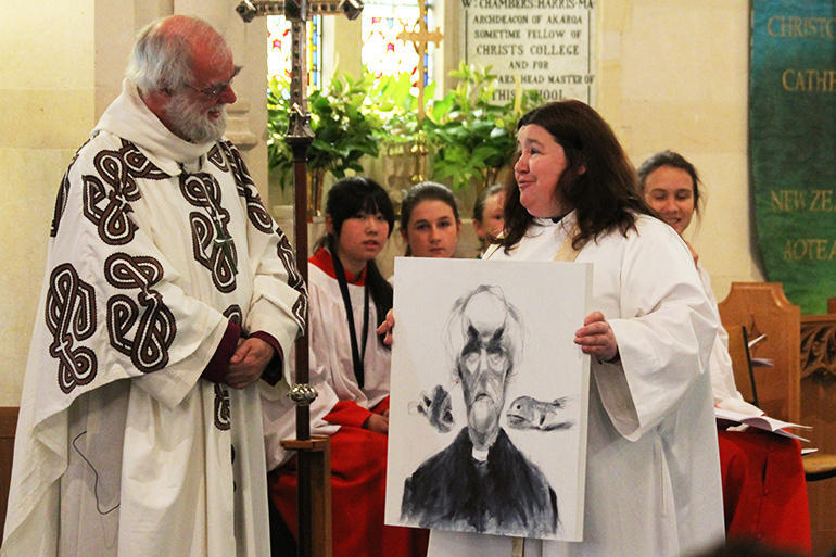 Lynda Patterson makes a presentation to the former Archbishop of Canterbury,Dr Rowan Williams.