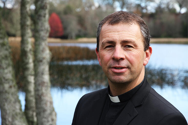 Andrew Hedge beside Te Koutu Lake, in Cambridge - where he's been the vicar for six years.