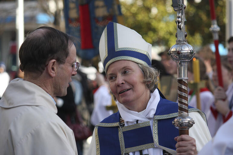 Bishop Victoria chats with a colleague at her installation.